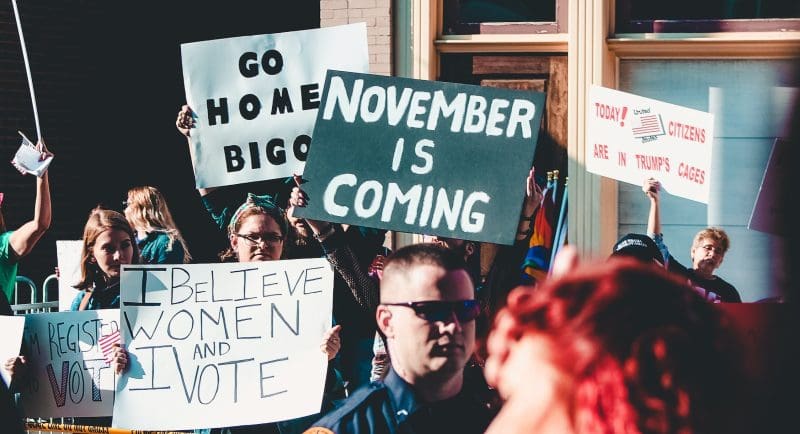 people-holding-banner-1